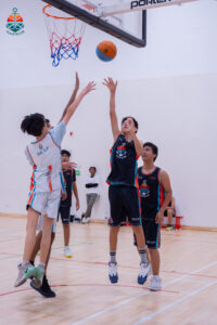 Harbor Sports Academy basketball players in action during tournament match play