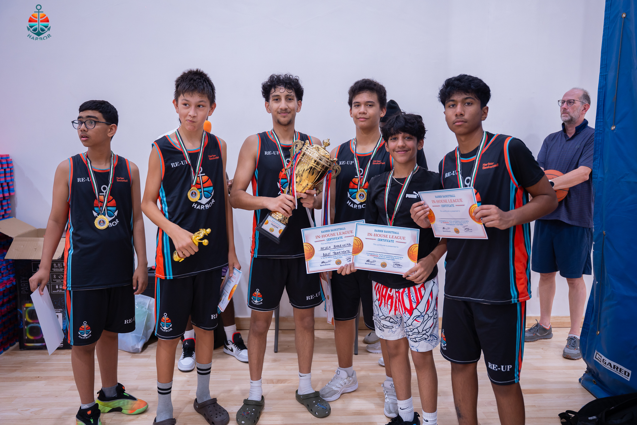 Harbor Sports Academy basketball team group photo with trophies and medals after the tournament