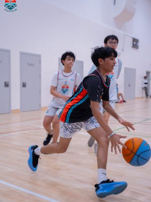 Harbor Sports Academy player driving the ball with teammates trailing the play